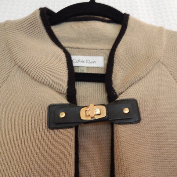 Calvin Klein Cape, tan with black piping on trim and armslits. - Picture 2 of 2